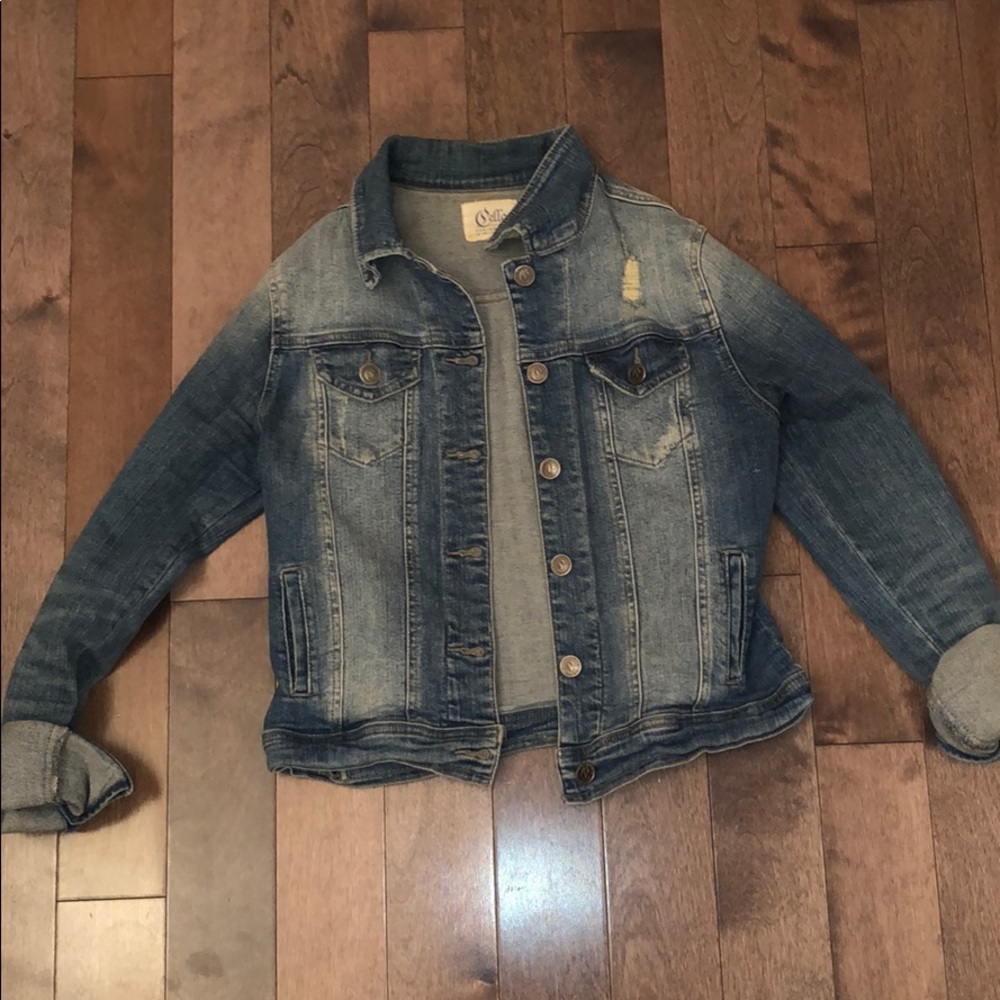 Medium wash distressed denim jacket!